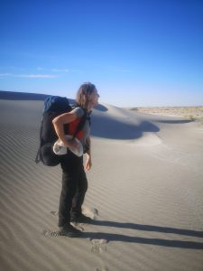 Explorer Pom Oliver Standing in the Aral Desert